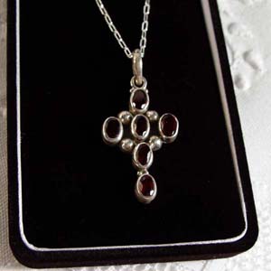 Faceted garnet  and sterling silver cross